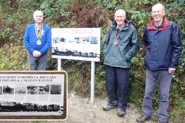 Nev Meeks (left) unveiling the new heritage information board in High Wood, Liskeard, alongside Brian Oldham and Peter Murnaghan