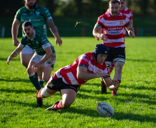 Saints withstand late comeback to secure hard-fought victory