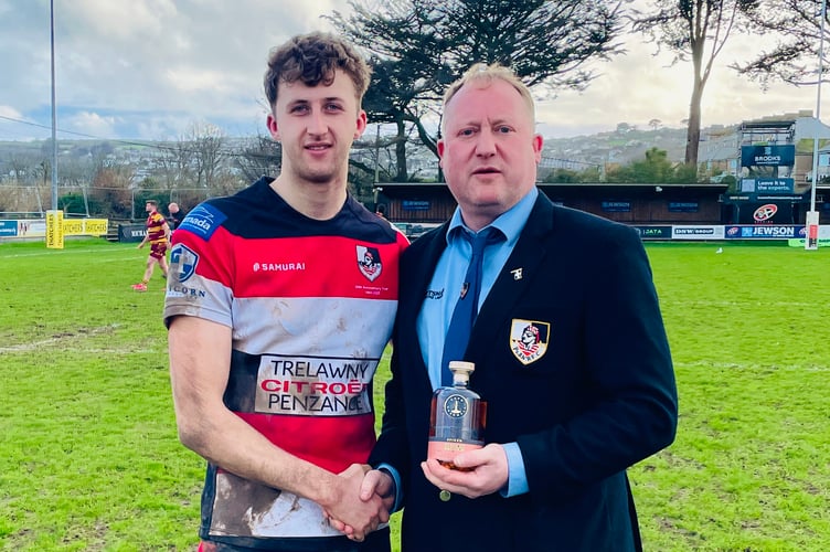 Jack Nicholas presents the man of the match award to hat-trick man Ben Wragg.