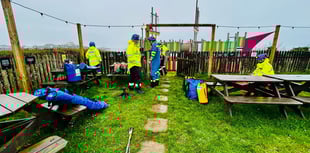 Coastguard rescue man from cliff edge 