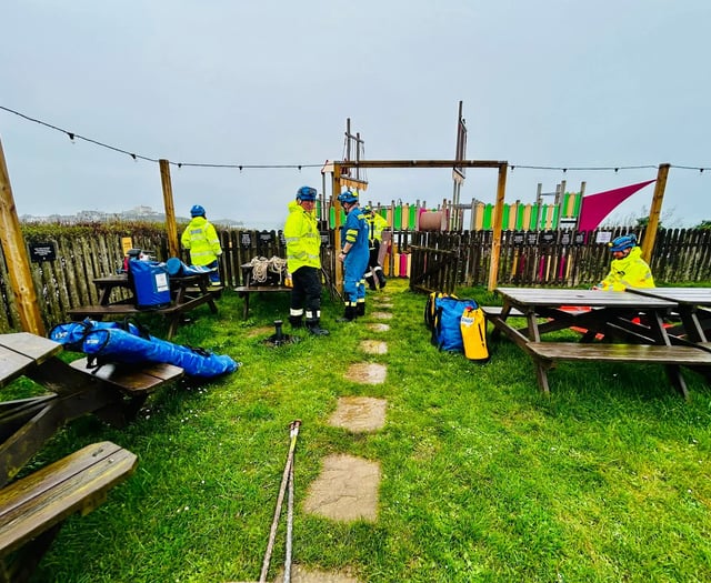 Coastguard rescue man from cliff edge 