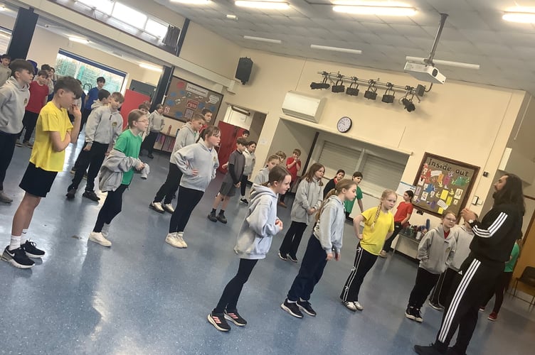 Youngsters from Burraton CP School engage in some activities with Tom Wilson, aka 'Hammer' , from Gladiators