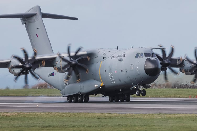A Royal Air Force A400, tail number ZM418, performs touch and go circuits at Cornwall Airport Newquay by RAF St Mawgan. The aircraft flies from RAF Brize Norton and was operating under the callsign Grizzly82. 