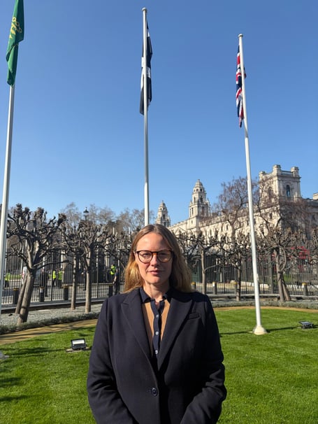 MP Anna Gelderd stands with the Cornish flag at Parliament