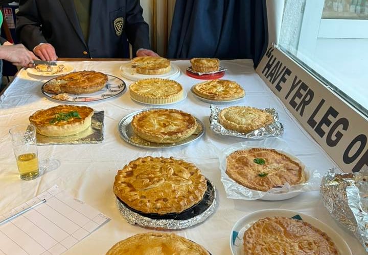 John Harris judging the pies