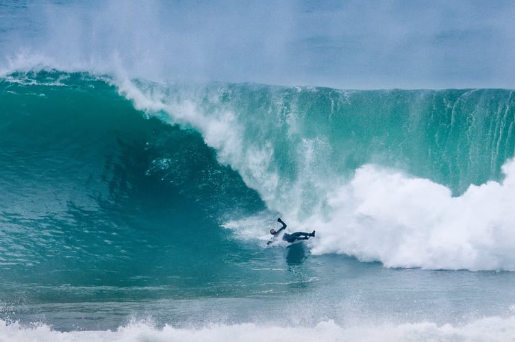 Tom Butler landing in the trough of the wave during his wipeout (Picture: Geoff Tydeman) (