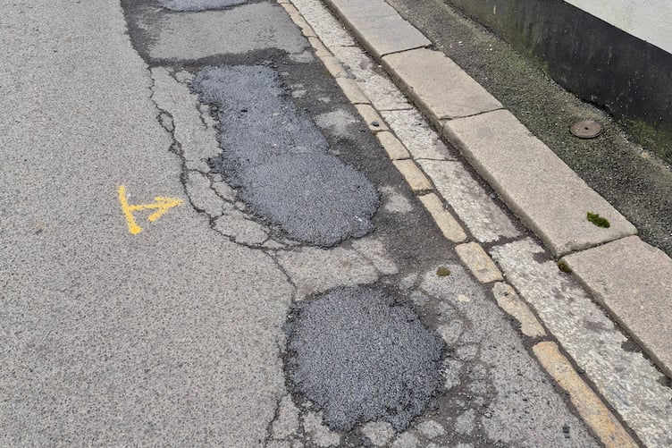 Some of the pothole repairs in the centre of Fowey.