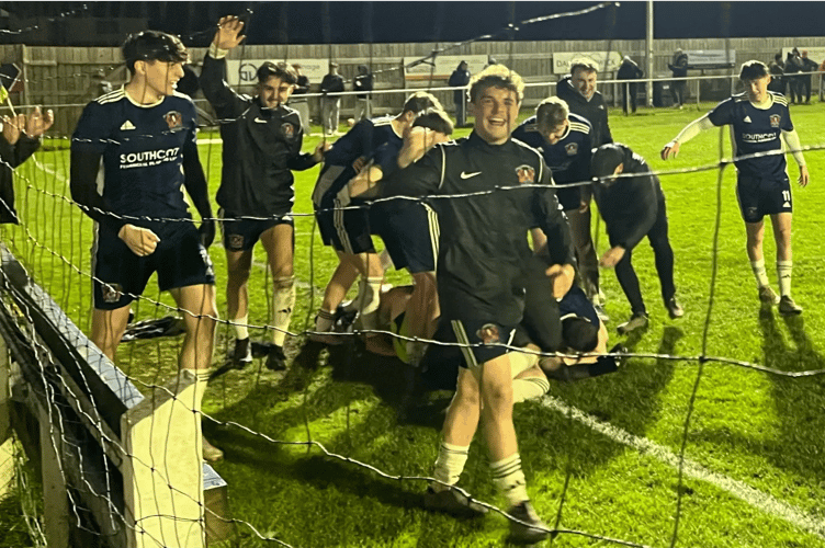 Callington players celebrating the shootout win.