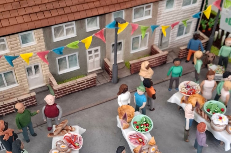 A close up of the community-inspired cake produced by Niki Lowe for the event at the Eden Project