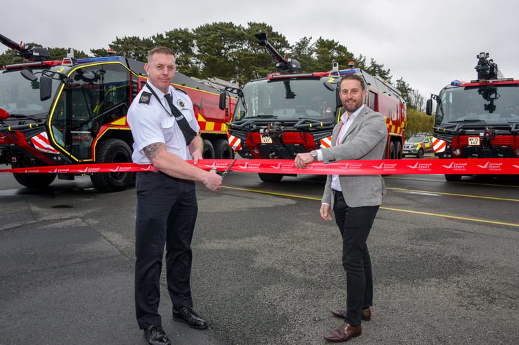 (L-R) Charles Dixon, the senior airport fire officer at Cornwall Airport Newquay unveils the new fire trucks with  Ian Robertshaw, Rosenbauer the managing director 