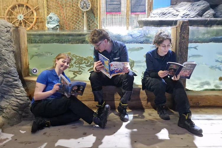  Staff at Blue Reef Aquarium Newquay enjoying reading library books