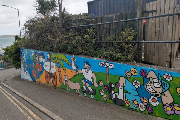 The surf vibe mural has helped brighten up a drab wall (Picture: Warren Wilkins)