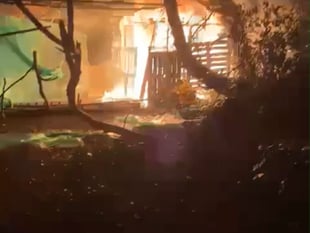 Arson suspected after man-made den caught ablaze 