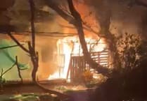 Arson suspected after man-made den caught ablaze