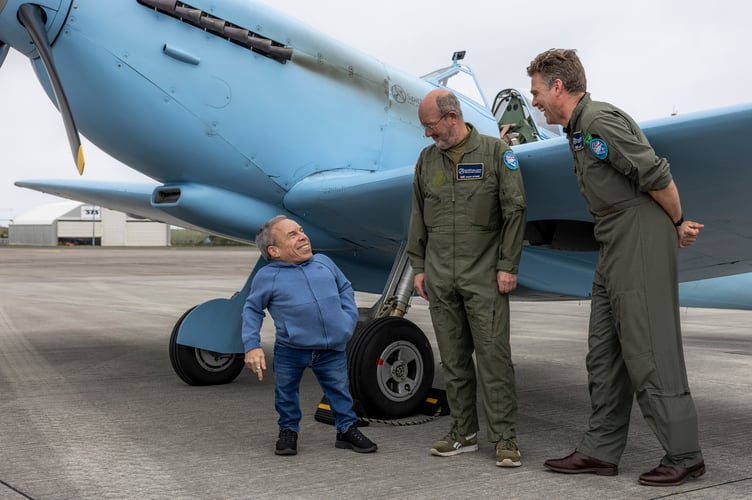 Image shows actor Warwick Davis in conversation with pilot for this leg, Mr Dave Stobie (Middle) and Spitfires.com CEO and pilot Mr Matt Jones. A historic RAF Spitfire touched down in Cornwall today as part of the nationwide Spitfire 90 Tour, marking 90 years since the iconic aircraftâs first flight and raising funds for two important RAF charities.The legendary aircraft arrived at Cornwall Airport Newquay (CAN) at 1148 hrs on Thursday 16 April, drawing aviation enthusiasts, personnel and special guests eager to witness a living piece of British history.The visit formed part of the Spitfire 90 Tour, delivered by Spitfire.com and supported by the Battle of Britain Memorial Flight. The tour commemorates the Spitfireâs first flight in 1936 and aims to raise funds for both the Mark Long Trust and the RAF Benevolent Fund, supporting serving personnel, veterans and their families.Despite bestlaid plans, unpredictable weather required adjustments to the flyingprogramme, resulting in the Cornwall visit taking place on Thursday 16 April rather than the originally advertised date, Wednesday 15 April. The changes highlighted the complexities of operating historic aircraft and the importance of safety led decision making.Among those fortunate enough to witness the Spitfire on the ground was BAFTAawardwinning actor Warwick Davis.