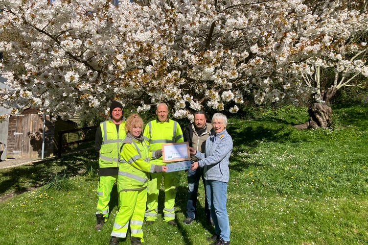 Lesley Friel, chair of Newquay in Bloom presenting the award in Trenance Gardens