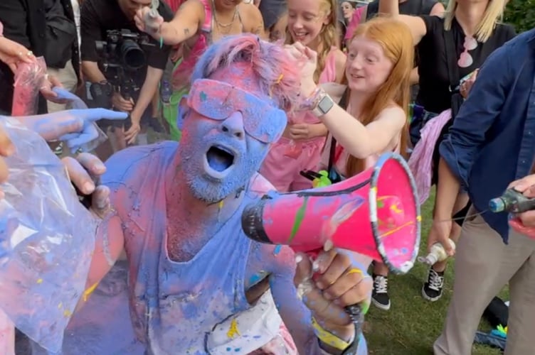 Graham often got covered in paint during the tour