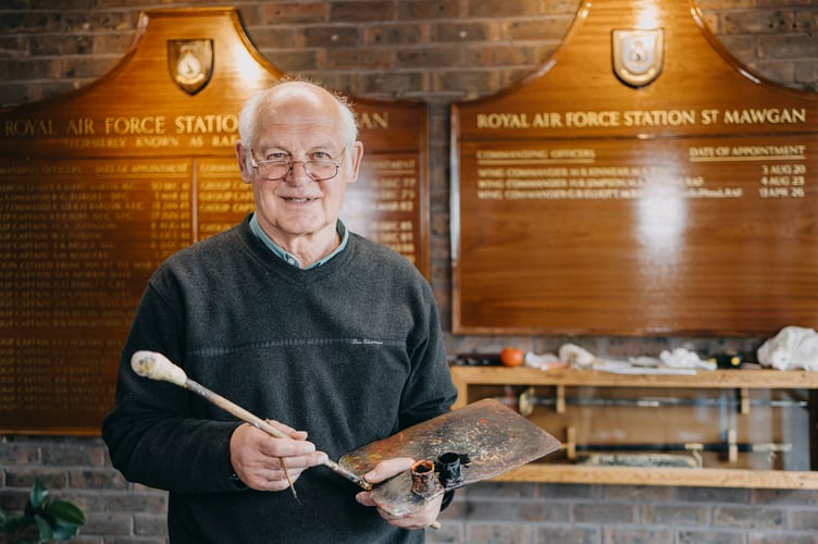 Images of  the David Dunkley, Director of Parc Signs, hand painting the name of incoming Station Commander, Wing Commander Gareth Elliot, onto the command board. Mr Dunkley has personally added the name of every Station Commander to the board since 1982. 