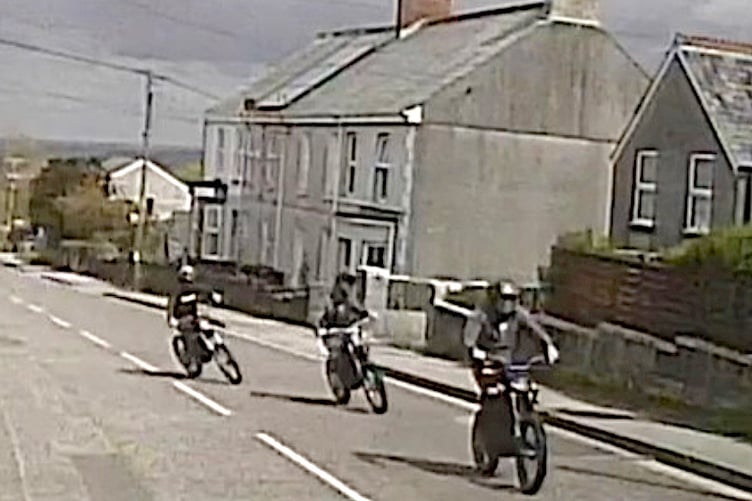 The picture posted by police showing three riders on non-registered e-motorcycles in Stenalees, near St Austell. (Picture: Devon and Cornwall Police)