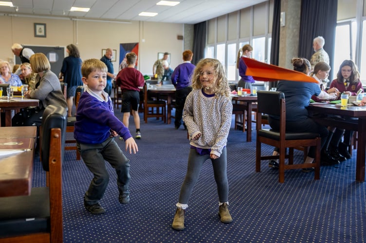 RAF St Mawgan welcomed a vibrant and diverse group of military connected children,school staff and veterans to the Mess this week for a heart-warming intergenerationallunch, celebrating community and connection across generations during Aprilâs Month ofthe Military Child.The event marked the culmination of a six-week Airplay-led Intergenerational Project,designed to explore military identity, encourage peer networking and strengthen linksbetween young people and veterans within the local community. Building on the success ofits 2025 pilot, the project has expanded this year thanks to generous funding from NewquayTowan Blystra Lions Club, matched by the RAF St Mawgan Veteransâ Fund, enabling evenmore children to take part.The day brought together military and civilian Station personnel to host and support theguests, creating an inclusive and welcoming atmosphere where all ages could connect,share stories and enjoy each otherâs company.
