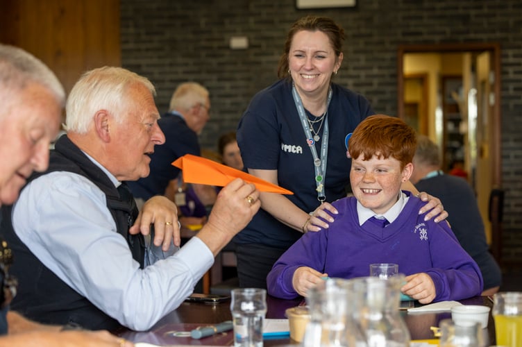 RAF St Mawgan welcomed a vibrant and diverse group of military connected children,school staff and veterans to the Mess this week for a heart-warming intergenerationallunch, celebrating community and connection across generations during Aprilâs Month ofthe Military Child.The event marked the culmination of a six-week Airplay-led Intergenerational Project,designed to explore military identity, encourage peer networking and strengthen linksbetween young people and veterans within the local community. Building on the success ofits 2025 pilot, the project has expanded this year thanks to generous funding from NewquayTowan Blystra Lions Club, matched by the RAF St Mawgan Veteransâ Fund, enabling evenmore children to take part.The day brought together military and civilian Station personnel to host and support theguests, creating an inclusive and welcoming atmosphere where all ages could connect,share stories and enjoy each otherâs company.