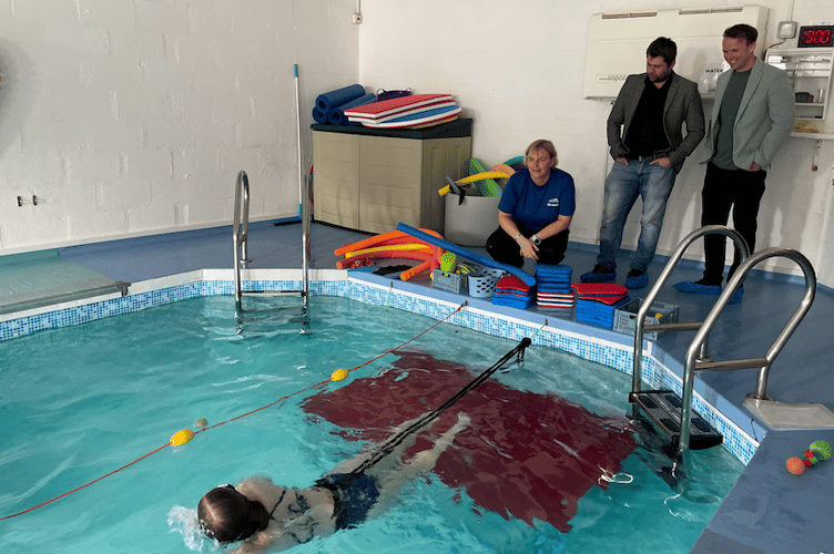 Mr Maguire and Cllr Frost were able to see one of the centre's young swimmers using the static swim belts (Picture: Warren Wilkins)