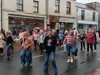 Rain can’t stop dancers in flash mob spectacle