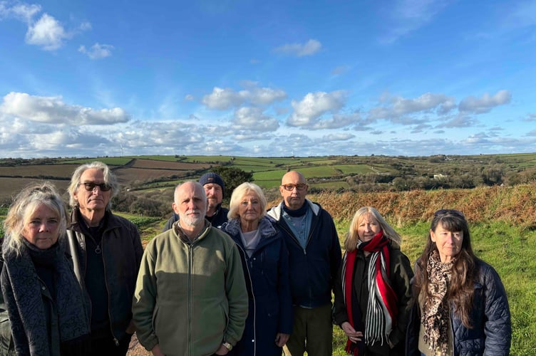 Some of the members of the Stop Trelion Solar Farm group. The panels would be placed on the ridge of land behind them. (Picture: Lee Trewhela/LDRS)