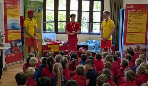 RNLI lifeguards provide pupils with water safety advice