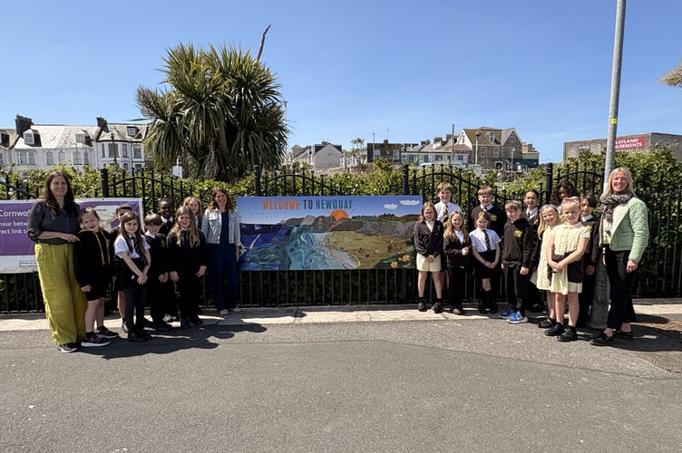 Pupils from Newquay Junior Academy next to their artwork, accompanied by Rebecca Catterall, Alissa Kindred and Lisa Mann 