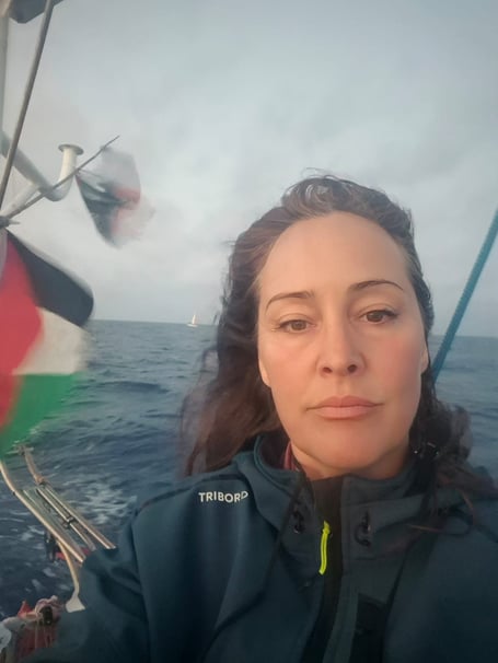 Katy Davison onboard her vessel on the voyage to Palestine
