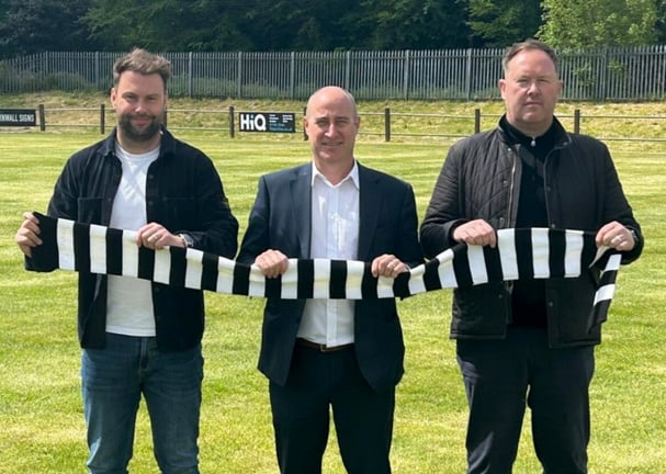 The Cornwall College Group chief executive Rob Bosworth (middle) with AFC St Austell joint managers Chris Knight and Olly Brokenshire.