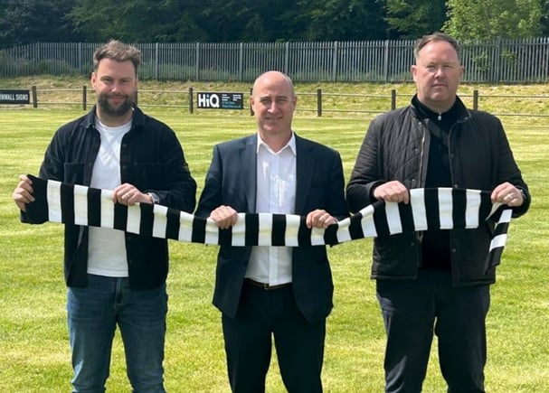 The Cornwall College Group chief executive Rob Bosworth (middle) with AFC St Austell joint managers Chris Knight and Olly Brokenshire.