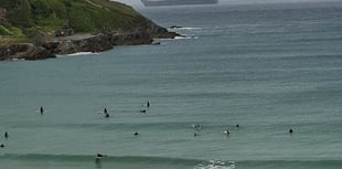Huge aircraft carrier looms out of the mizzle in Newquay Bay