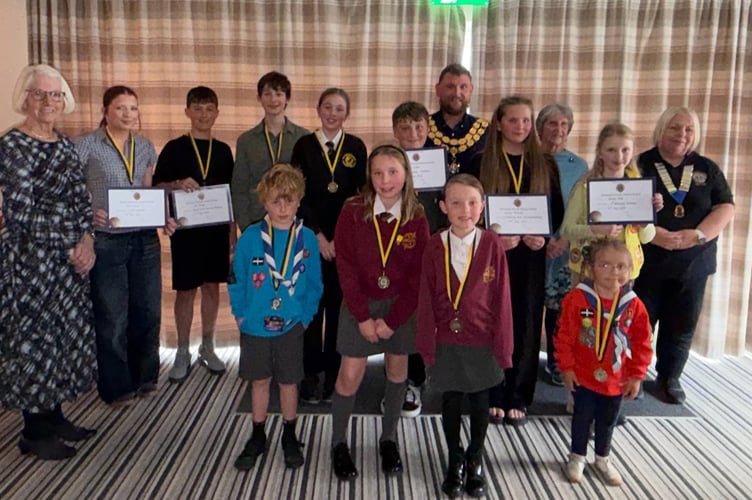 Award winners with their medals and certificates