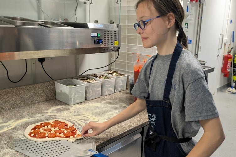 A student making a tasty pizza during the live cafe (Picture: Warren Wilkins)