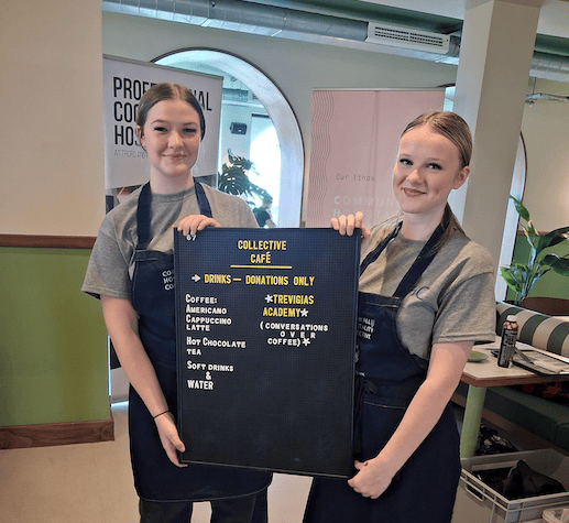 Students showcasing the menu for the live cafe