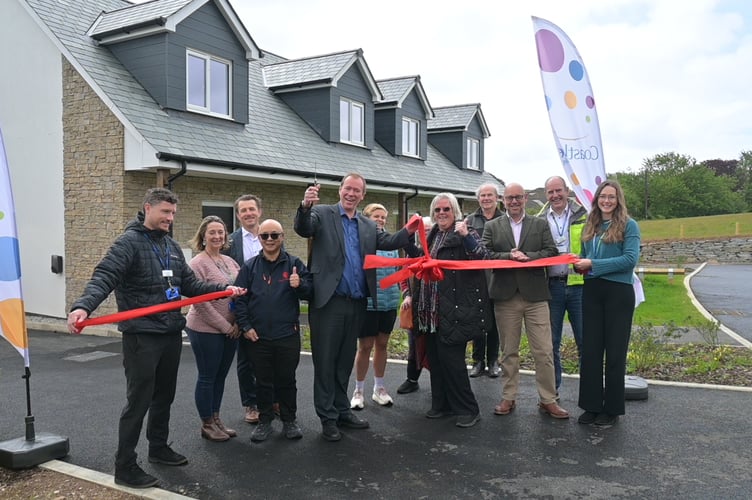 Cllr Julian German officially declares Ochre Works open, joined by representatives from Coastline, Classic Builders and parish councillors. (Picture: Coastline)