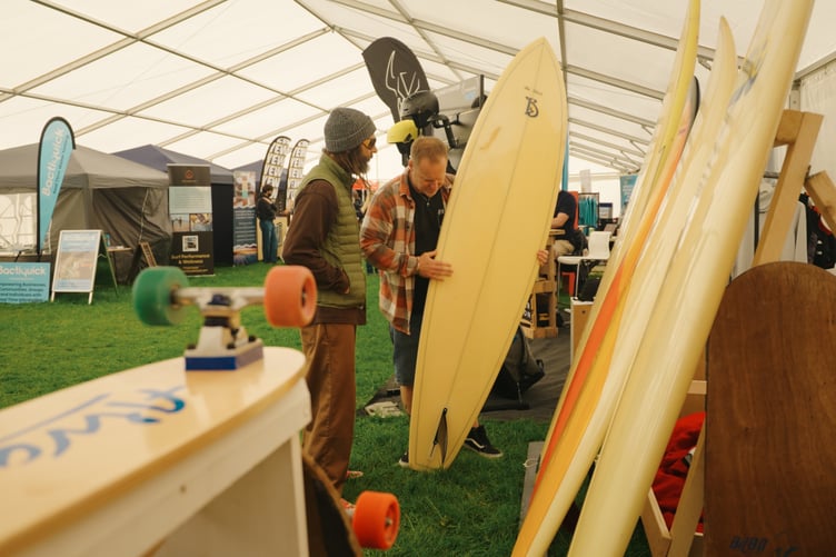 Skate legend Tony Alva checks out a single fin surfboard at last year's Surf and Skate Expo (Picture: Ben Roberts)