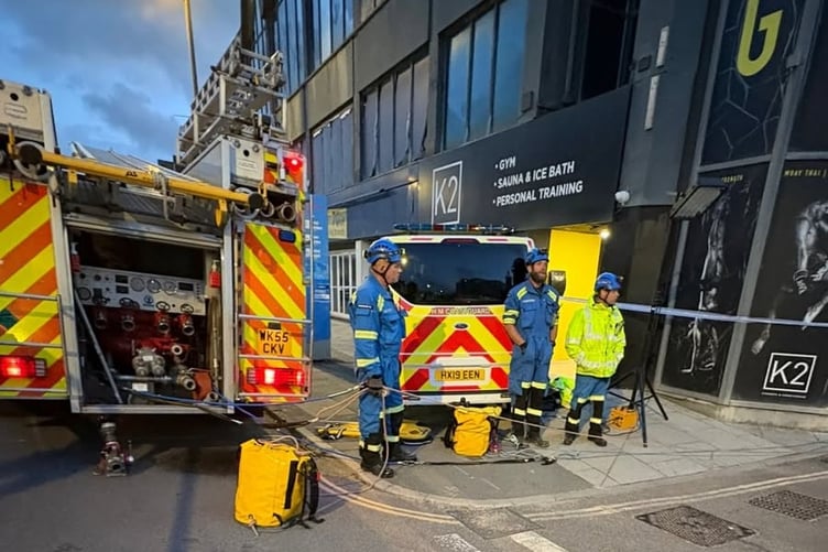 An arial ladder platform from Truro Fire Station was used to bring the woman to safety (Picture: HM Coastguard Padstow)