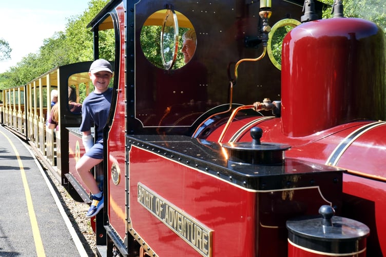 A young steam enthusiast on the foot plate of the Spirit of Adventure