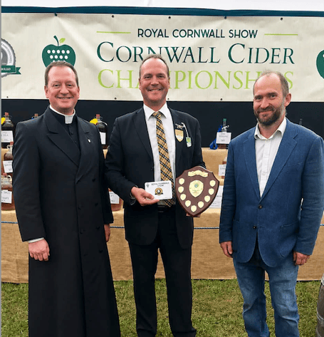 The cider championship award being presented (L-R) Rev Canon Scott Smith,David Berwick chairman of the Royal Cornwall Cider Championships and Ed Stein
