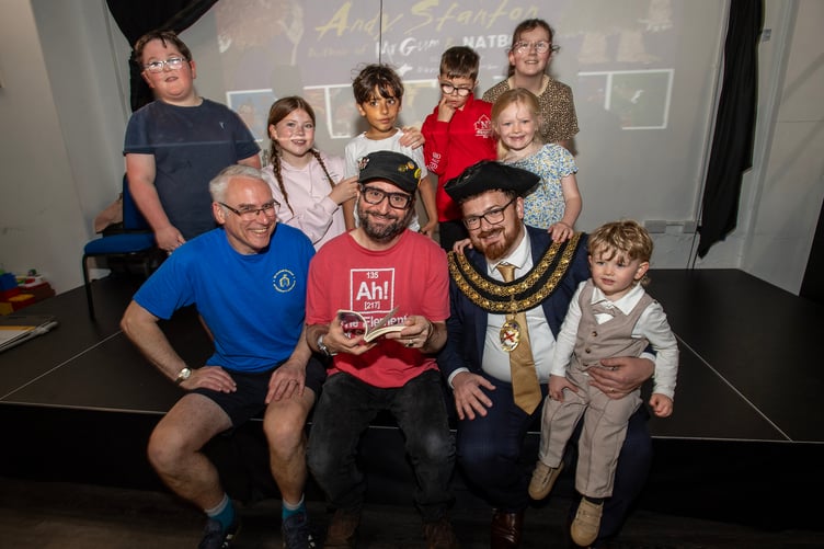 Author Andy Stanton with festival director Simon Pollard (left), the mayor of St Austell Cllr Ethan Stephens and young fans. (Picture: Paul Williams)