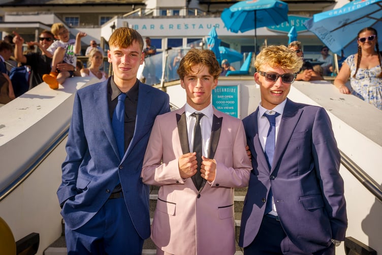 Students dressed in their finest frocks and smart suits