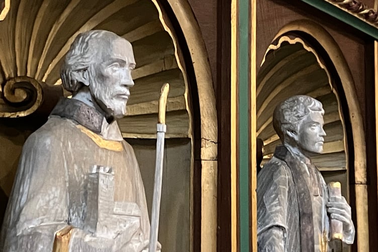 The statue of St Samson (left) stands alongside that of Truro-born missionary Henry Martyn at Truro Cathedral