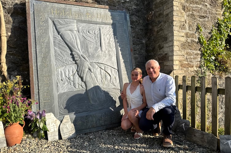 Barry West and grandaughter Lyla at the slate memorial sculpture created by Ben Dearnley for the 175th anniversary