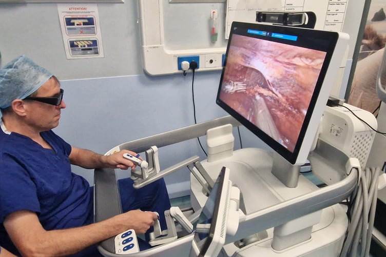 Surgeons using the hi-tech robotic surgical system.jpg
