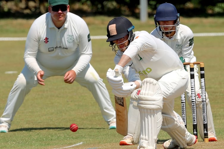 Callington batsman Jake Rowe blocks out this delivery under the gaze of Grampound Road's Alex Rust and Harry Gregory (Picture: Glen Rogers)
