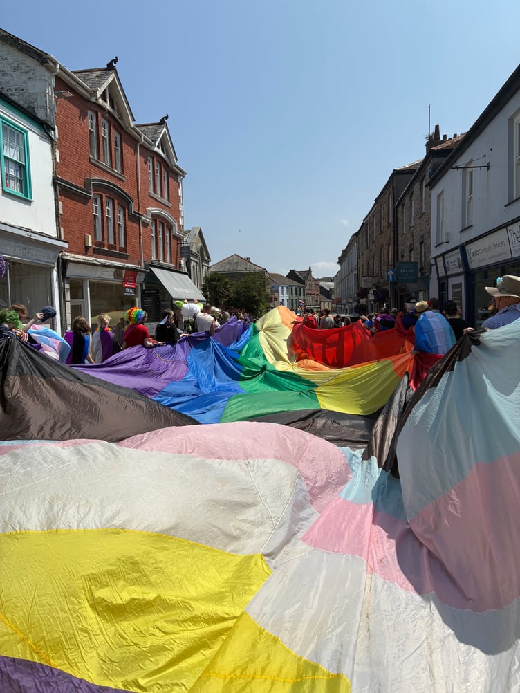 The Cornwall Pride flag wends its way down Truro's River Street