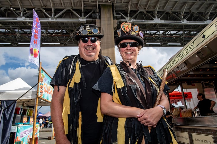 Members of the Wreckers Border Morris are all smiles as they take a well-earned break during the Saltash Regatta and Waterside Festival